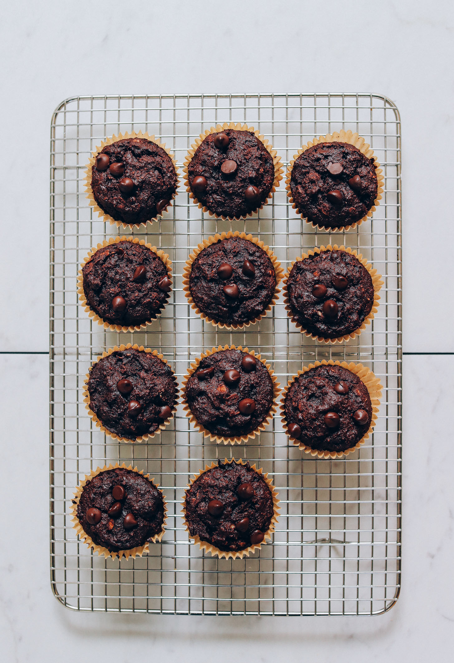 Cooling rack with a batch of our Fudgy Banana Chocolate Muffins recipe